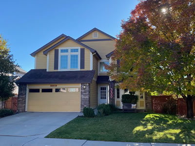 a house with a garage door and a driveway