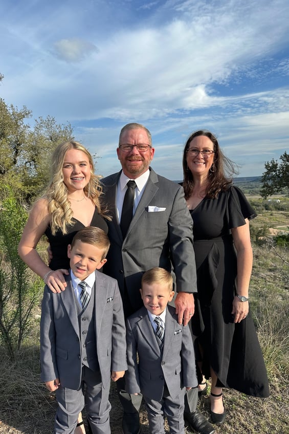 Andrew and family at a family wedding