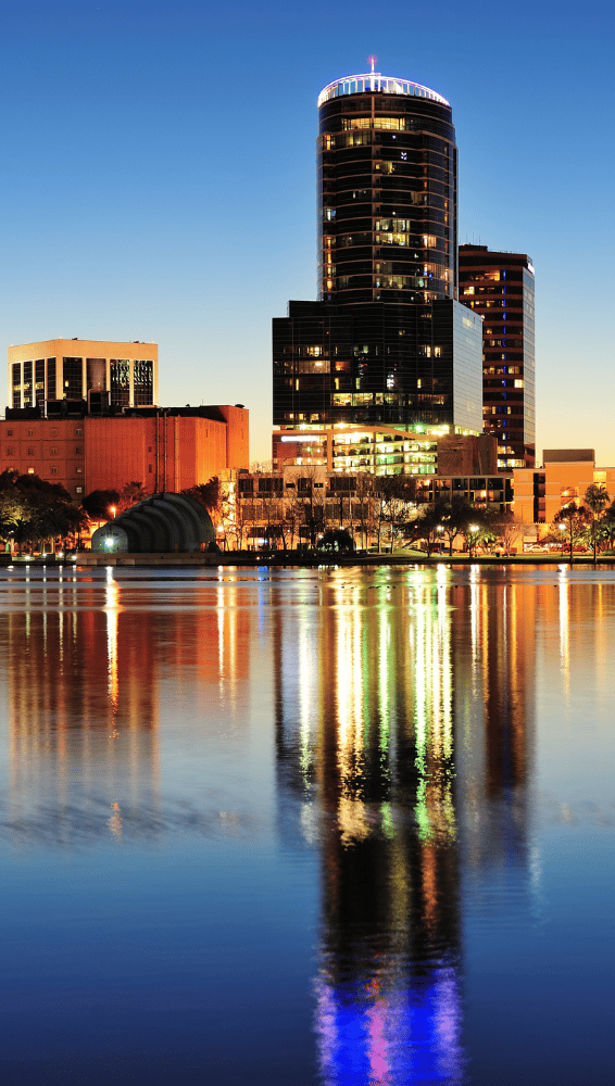 a city skyline with a river and a city skyline