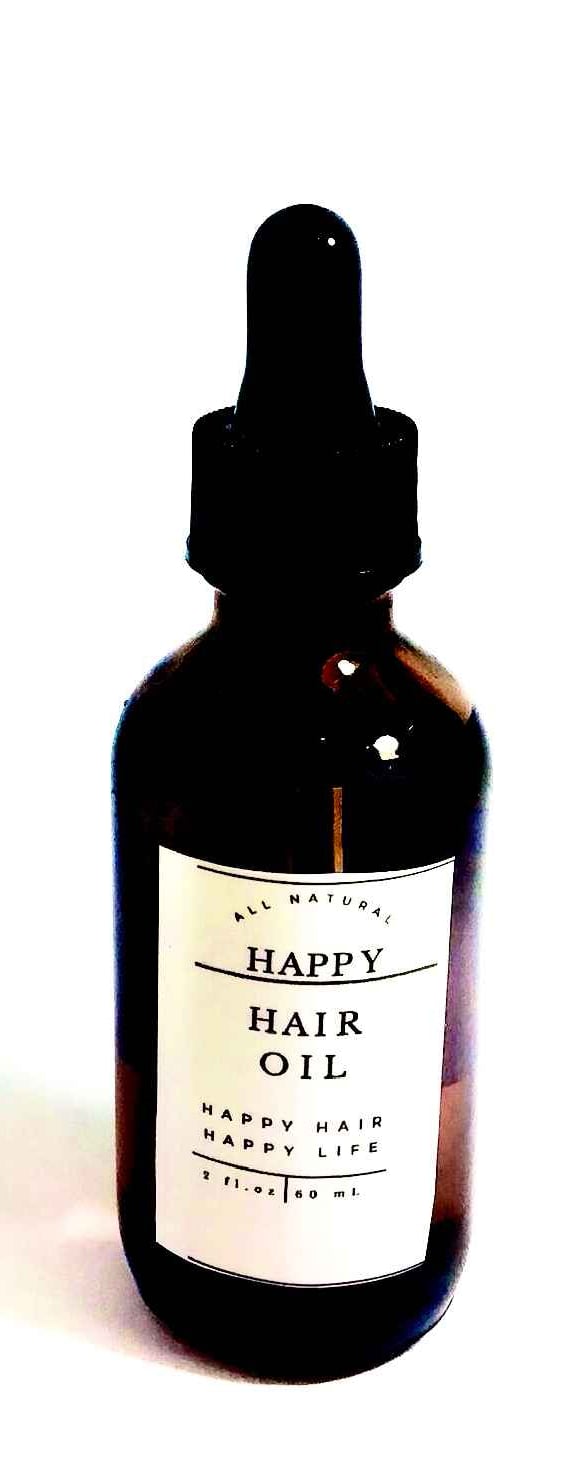 A happy hair oil bottle