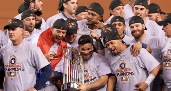 a group of baseball players posing for a photo