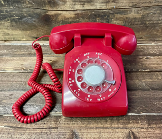 an old fashioned red telephone