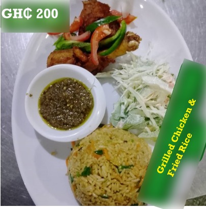 Grilled chicken and fried rice at de place restaurant Ghana