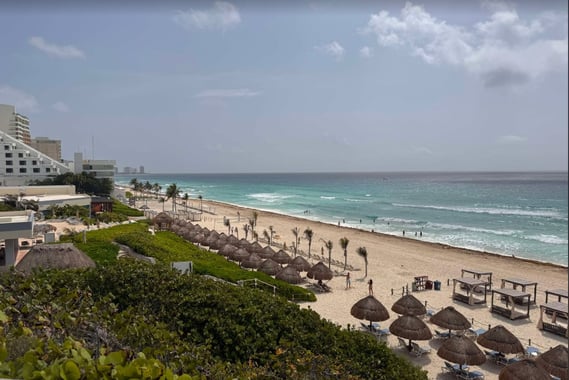 a beach with umbrellas and umbrellas on the beach