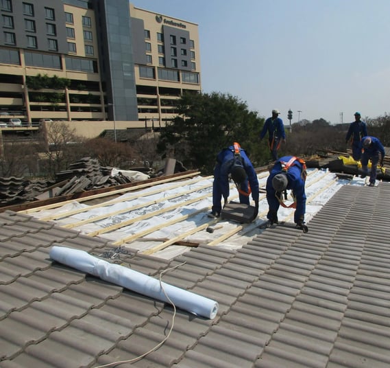 Laying roof tiles for roof installation Project, Environmental Pro Construction
