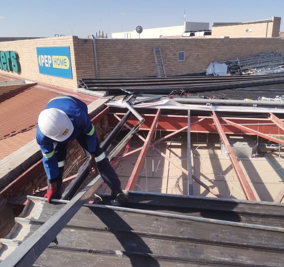 Environmental Pro Construction team replacing a roof structure on a commercial building in West Rand