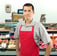 a man in a red apron and a red apron