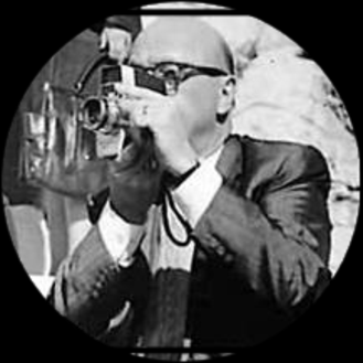 a man in a suit and tie is taking a picture