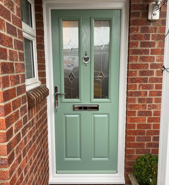 a new chartwell green l front door on red brick house installed by buildmydoor