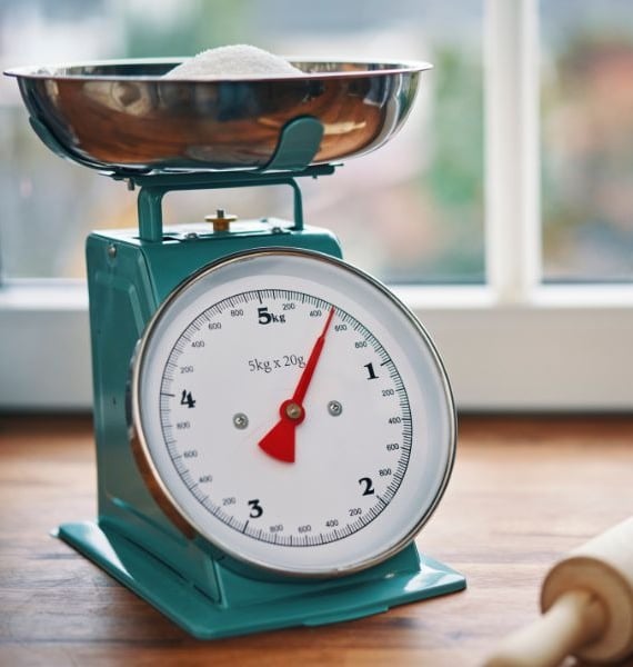 a kitchen scale with a rolling pin