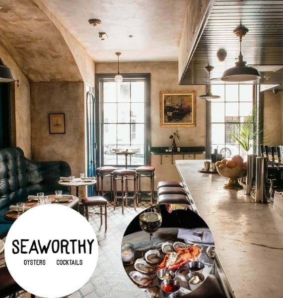 a restaurant with a table and chairs and a table with food