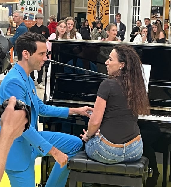 Mika talking to Helen Spooner after her performance on The Piano on Channel 4 at Brighton Station
