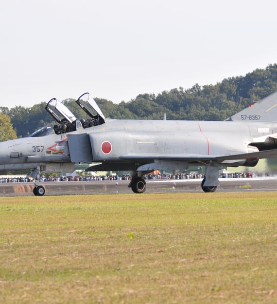 a jet fighter jet taking off from the runway