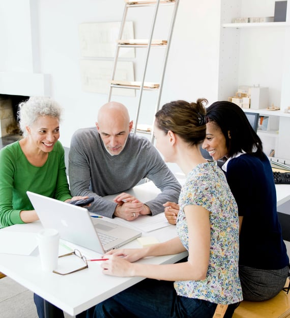 a group of people sitting around a table