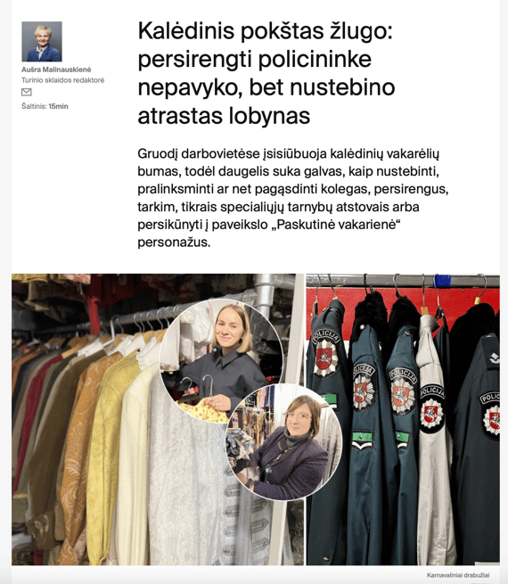Two women showing different clothes, they are at costume rental warehouse