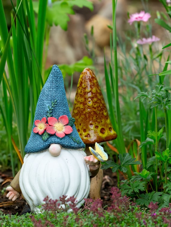 a gnome with a blue hat and a gnome with a blue hat on it
