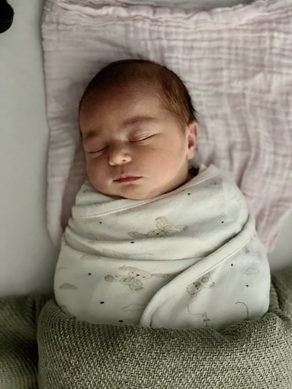 sleeping baby in swaddle