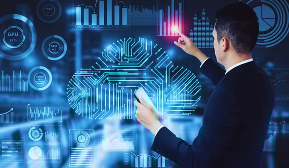 Business leader interacting with holographic charts and diagrams on a large touchscreen while holding a smartphone