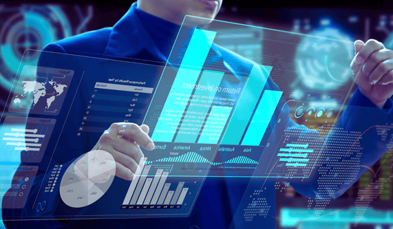 Business leader in a blue suit reviews holographic graphs and charts on transparent glass screens, face unseen.