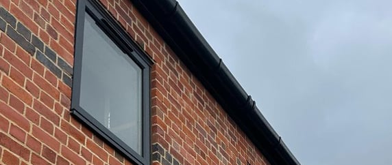 clean window on a house in ledbury