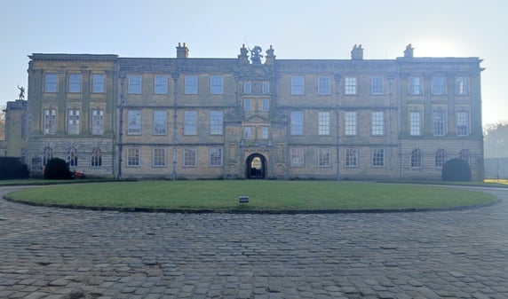 Entrance and front yard of grand mansion