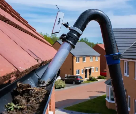 LEAVES BEING CLEANED OUT OF A GUTTERING ON A HOUSE BY keystone property care