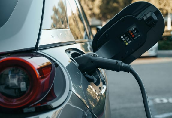a car is shown with a charging station attached to it