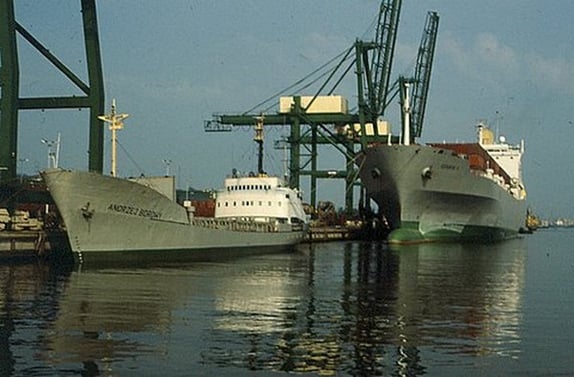 a large ship is docked at a dock