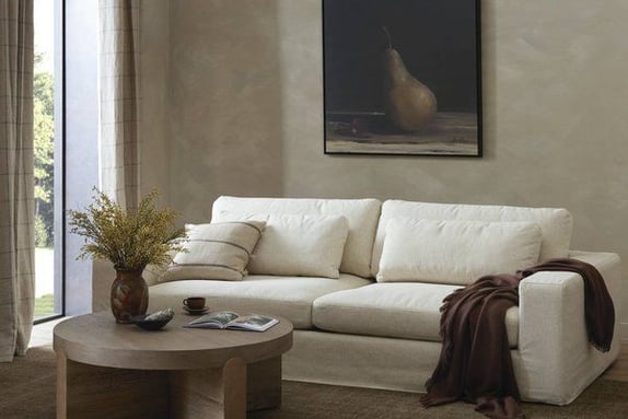 a living room with a couch and a table