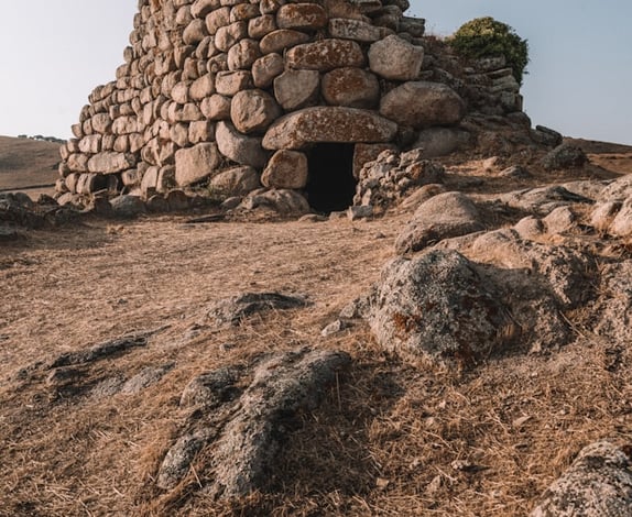 a stone wall with a small stone structure