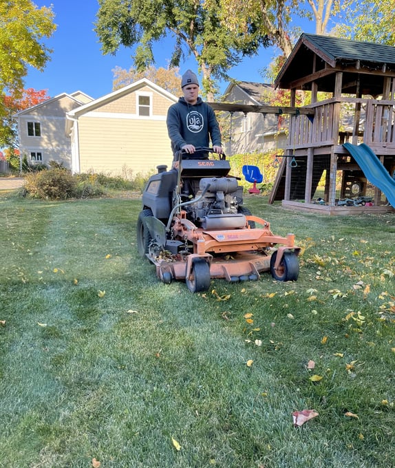 oja-lawn-and-landscape-employee-on-a-mower.jpg