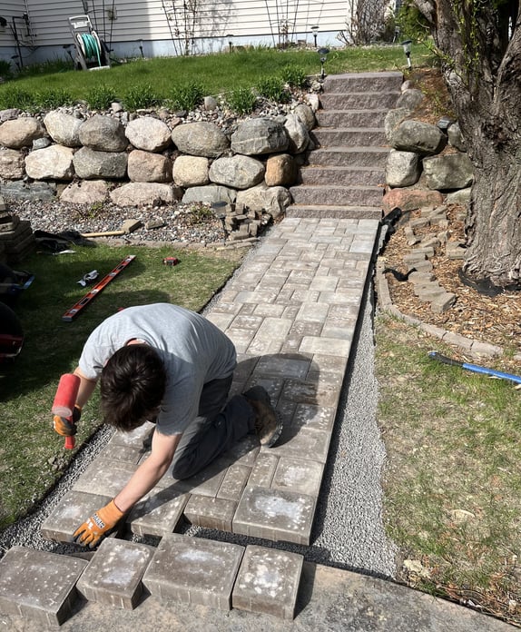 man-building-custom-walkway.jpg