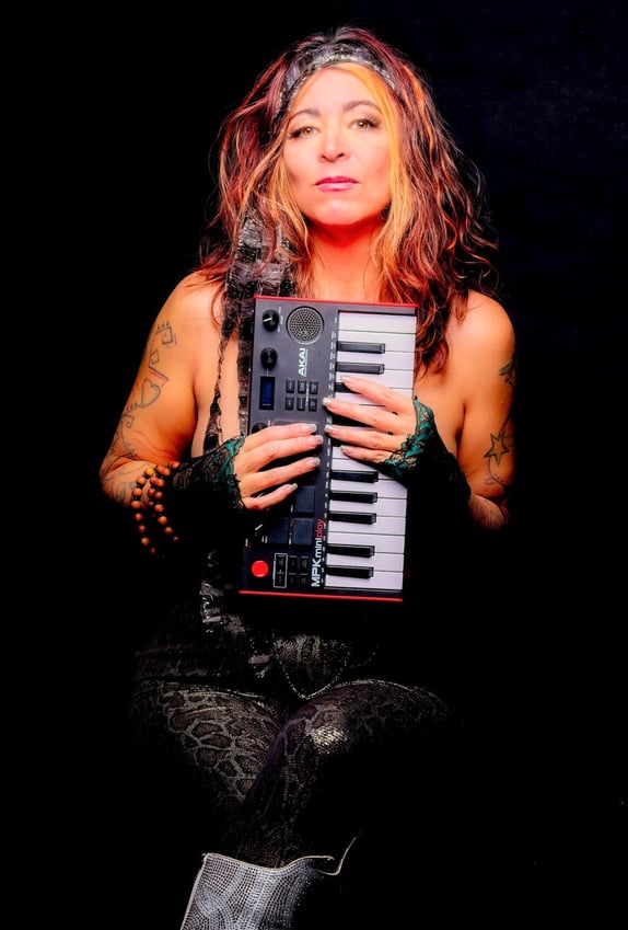 a woman with a guitar and a keyboard