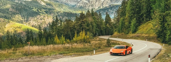 Lamborghini in front of landscape