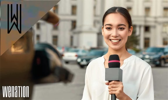 a woman in a white shirt is holding a microphone