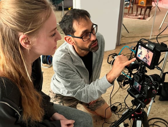 Young woman working with documentary filmmaker