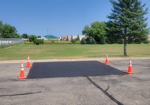 large-asphalt-repair-in-commercial-parking-lot.jpg