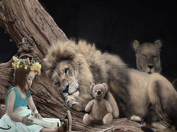girl reading by lion