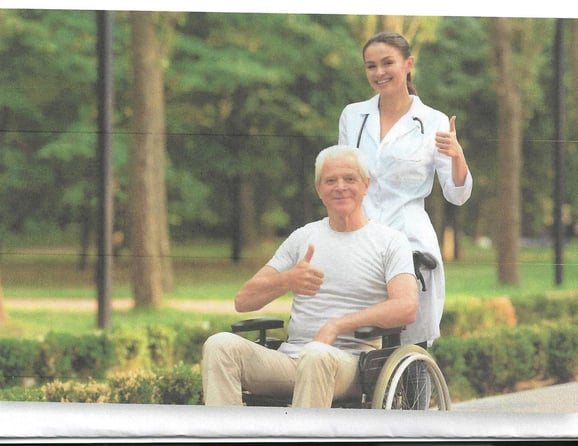 a nurse and a patient in a wheelchair
