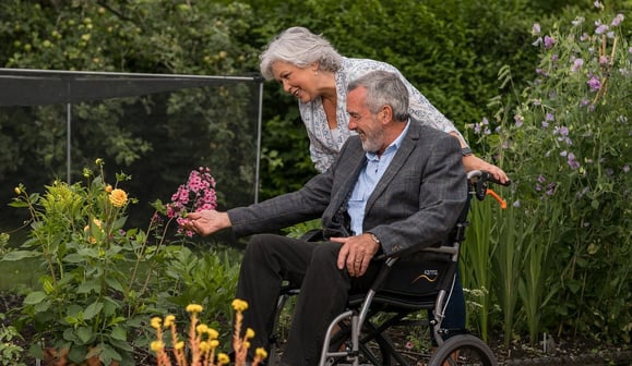 older adult couple man in wheelchair