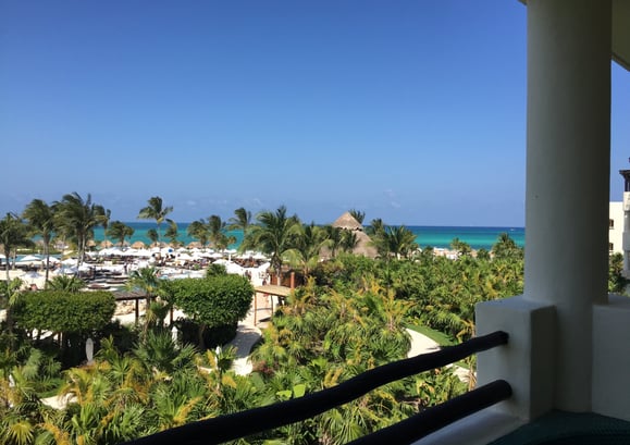 a balcony with a view of the ocean