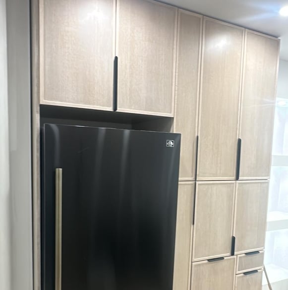 a refrigerator with a black refrigerator and a black refrigerator