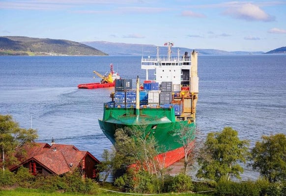 a large ship is docked in a harbor