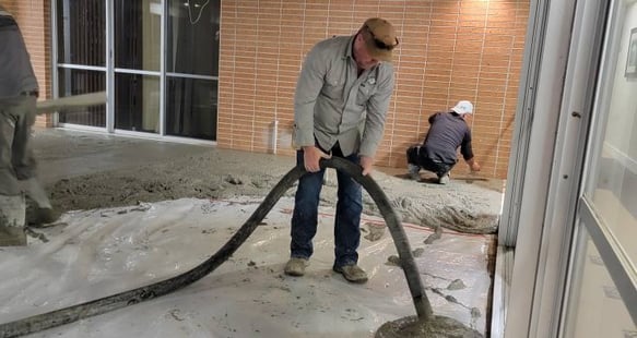 Pumping concrete through a hose