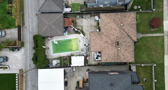 a house with a pool and a tennis court