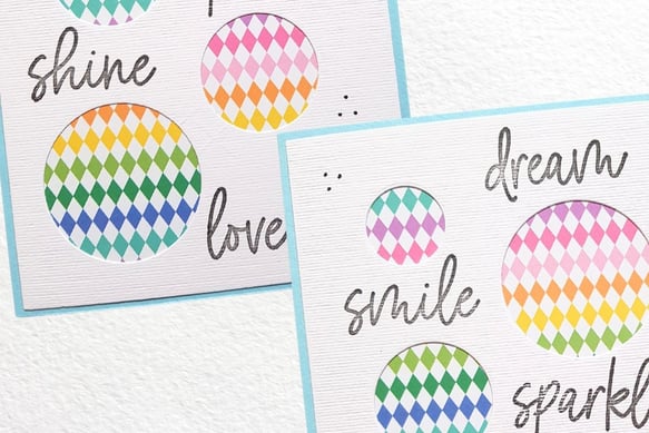 Colorful patterned circles on textured cards with words like "shine," "dream," "smile," and "sparkle