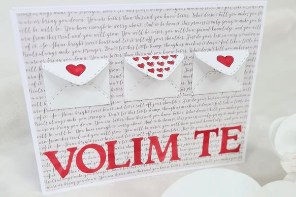 Greeting card with three small envelope designs on textured script background. Each envelope has red