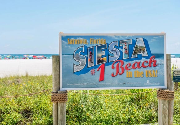 The Siesta Beach #1 in the USA sign