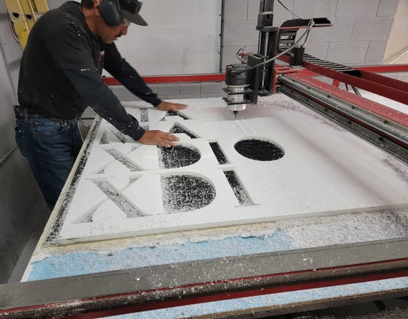 One of our employees working on one of our signs