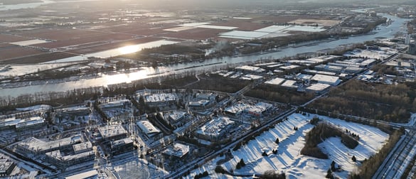 a cityscape of a city with a river and a bridge